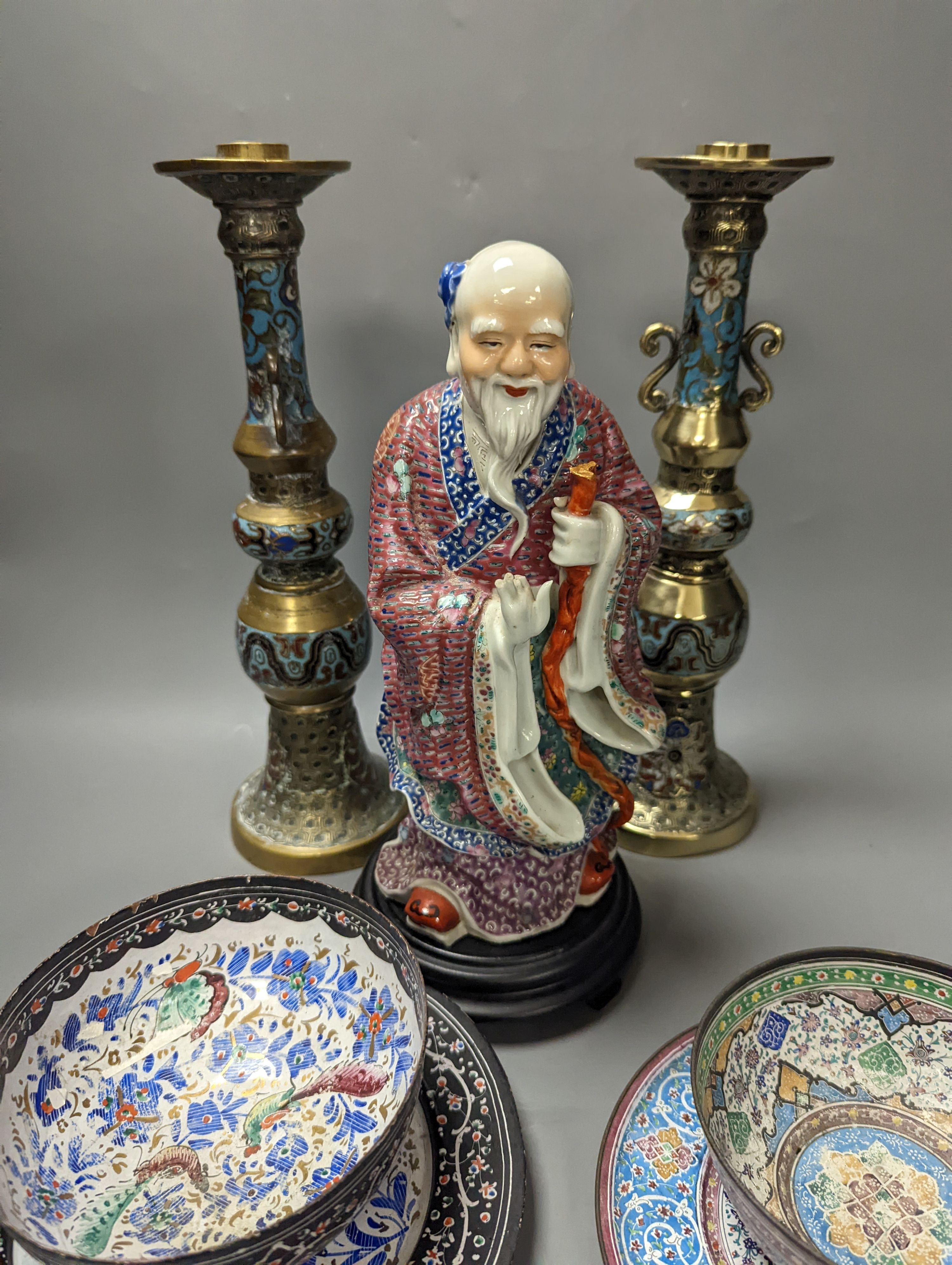 A Chinese porcelain figure of Shao Lao, a pair of Japanese bronze and champleve enamel candlesticks, Persian enamel wares etc